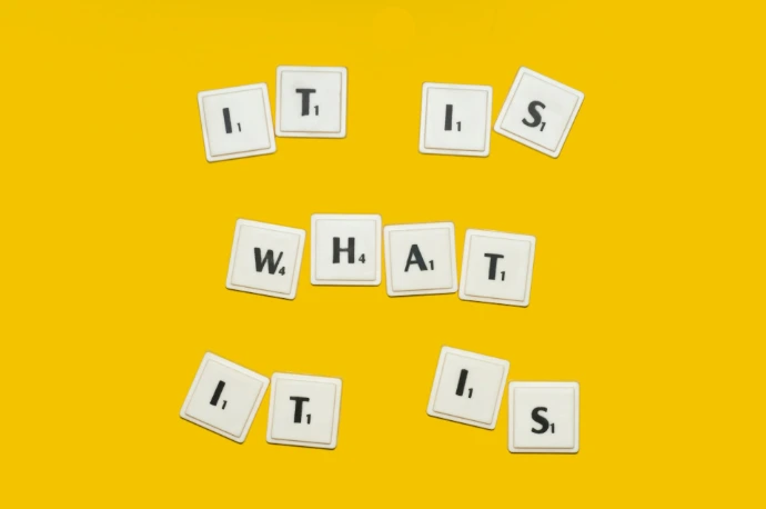 the words it's what it's spelled with small tiles